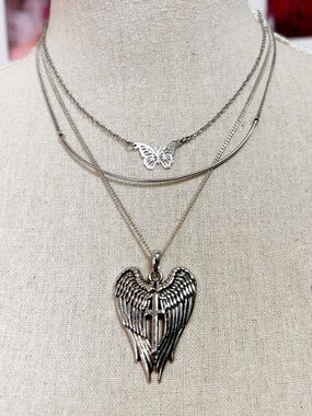 A trio of silver-toned necklaces, dainty necklace stack Angel Wings, Butterfly
